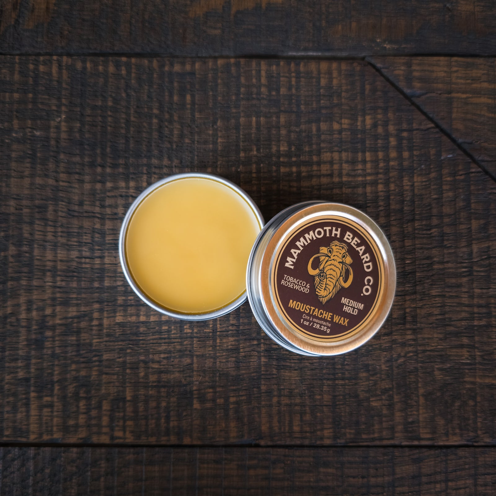 Open tin of Mammoth Beard Co Tobacco & Rosewood moustache wax showing smooth natural wax texture for medium hold styling