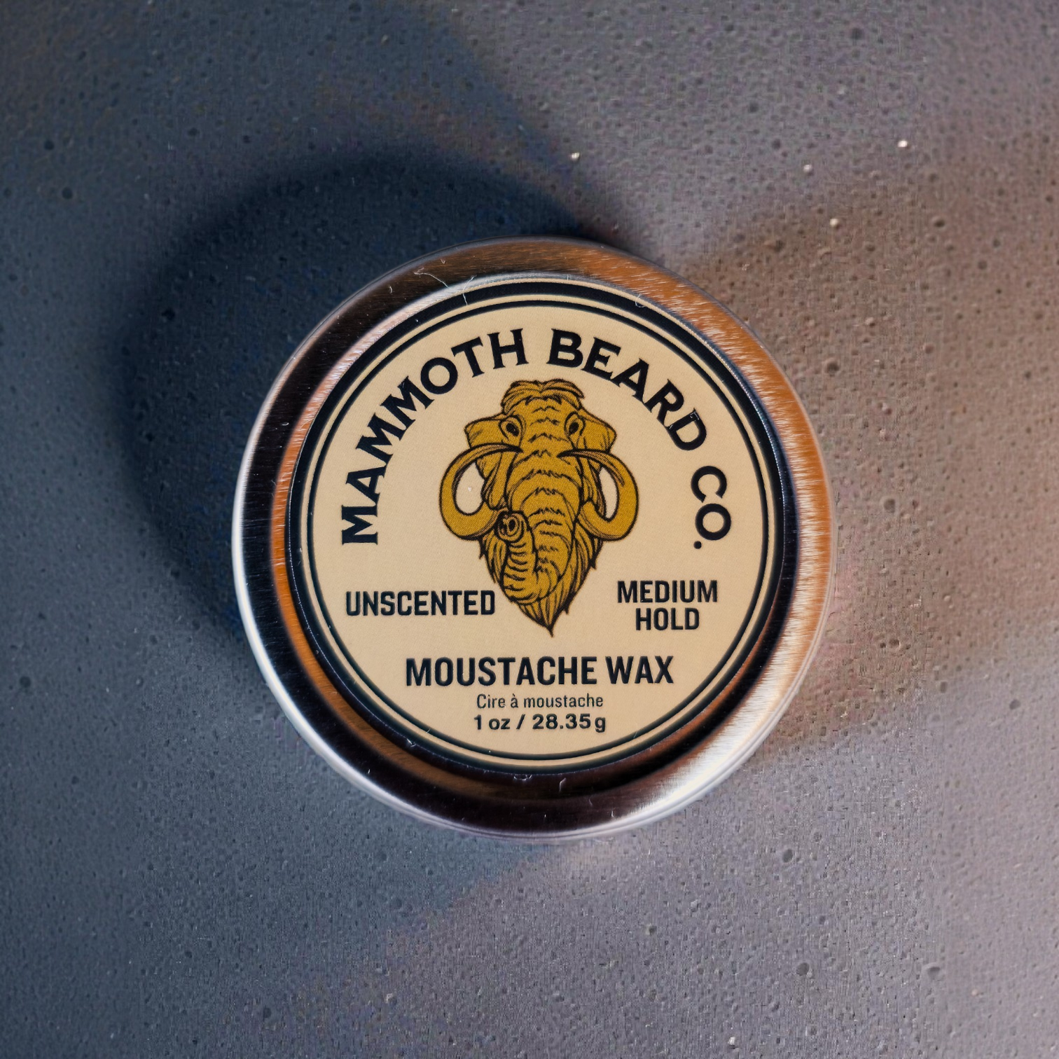 Mammoth Beard Co. Unscented Medium Hold Moustache Wax in 1 oz metal tin, top view, natural styling wax for shaping and controlling moustache without added fragrance.