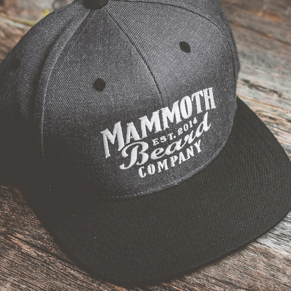 High-quality Mammoth Beard Co. apparel including t-shirts, hoodies, and hats, designed and printed in Canada.