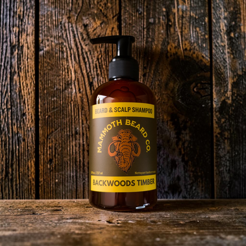 Bottle of Marmoth Beard Co. Backwoods Timber shampoo on a wooden background