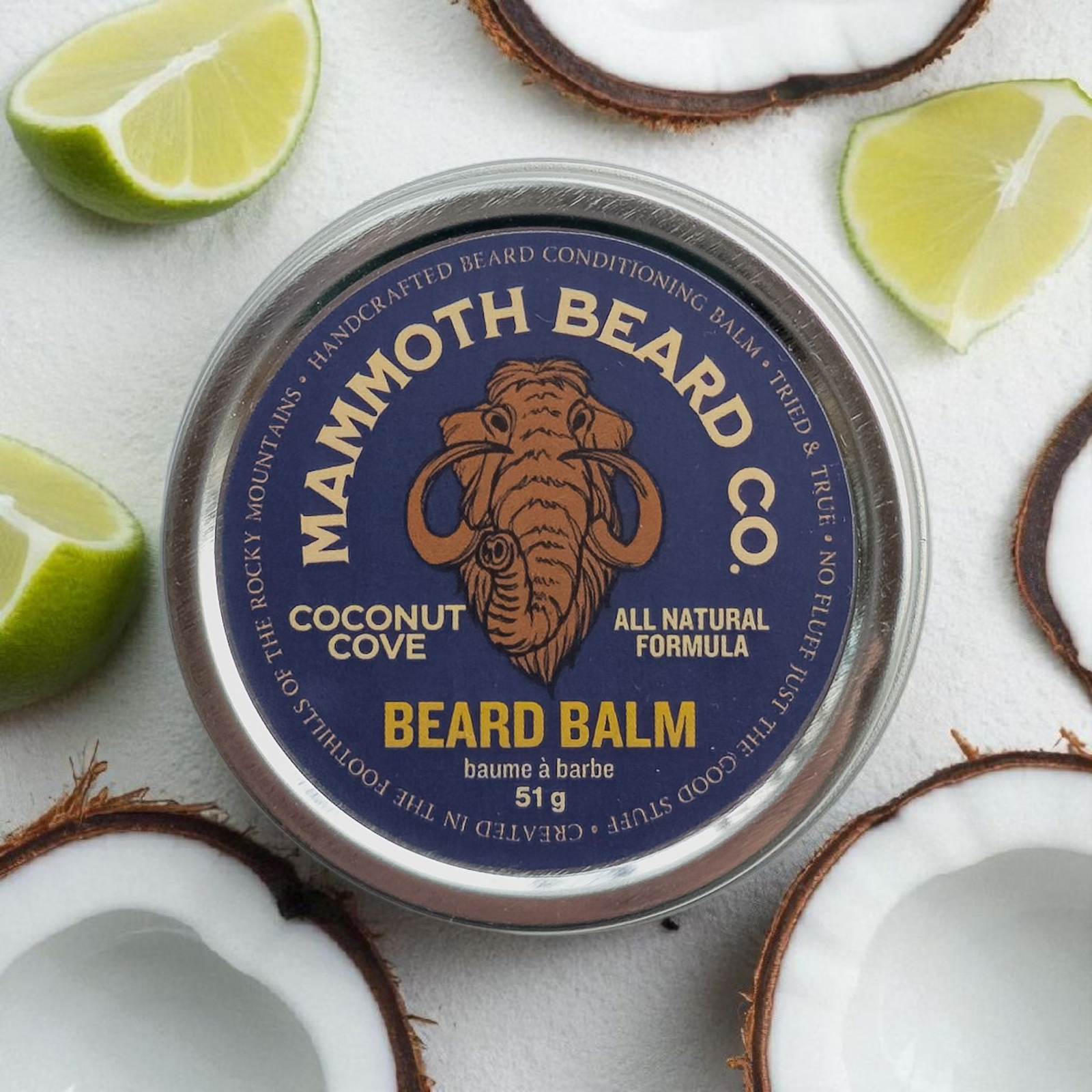 Mammoth Beard Co. coconut cove beard balm container with lime and coconut slices on a white background