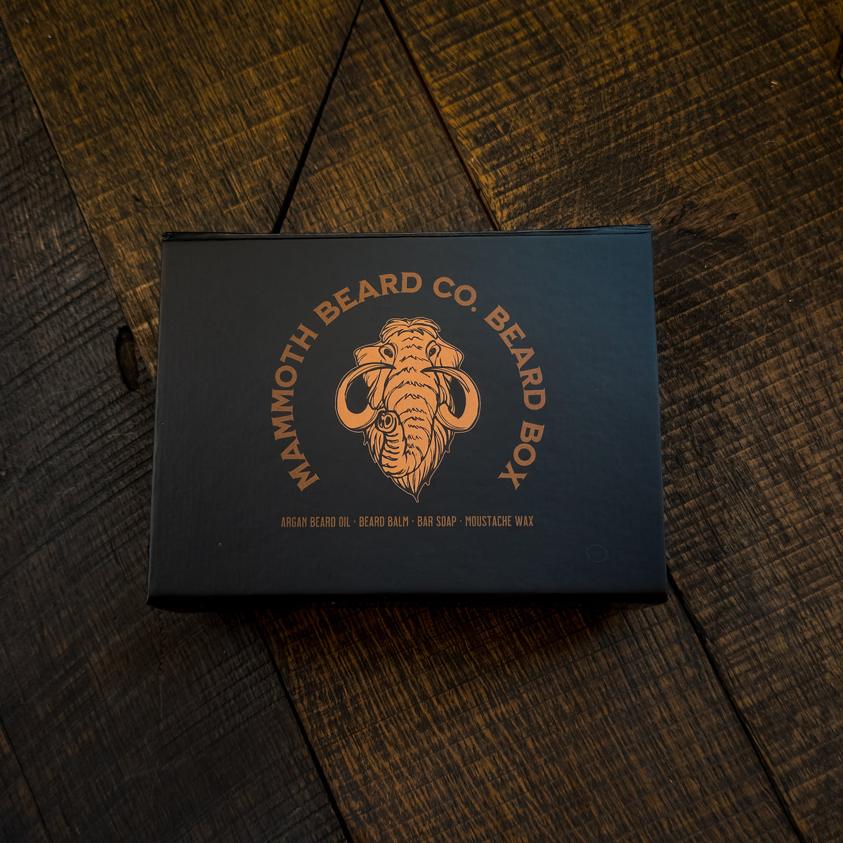 Mammoth Beard Co. beard box on a wooden surface