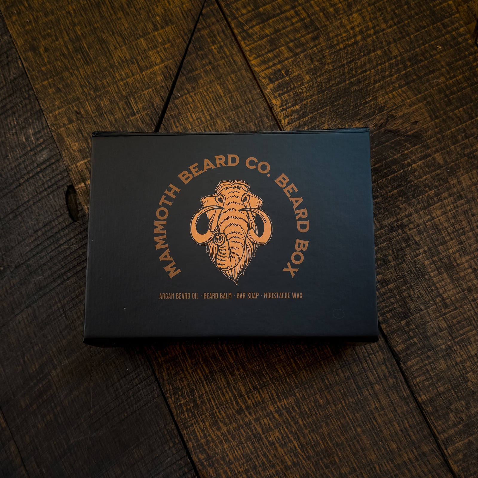 Mammoth Beard Co. beard box on a wooden surface