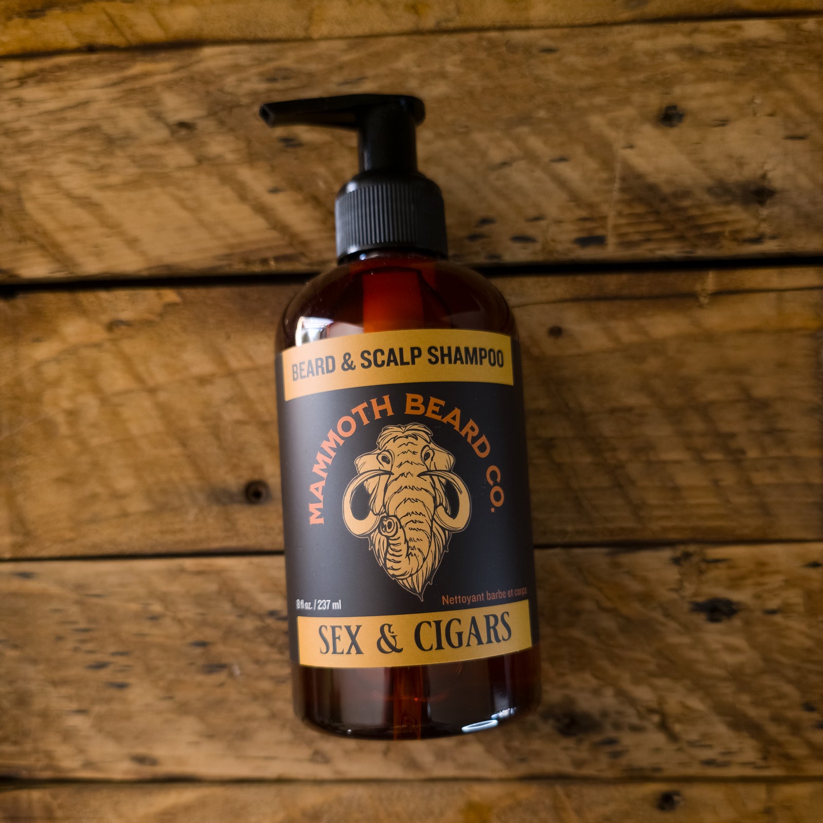 Bottle of Mammoth Beard Co. beard and scalp shampoo on a wooden background